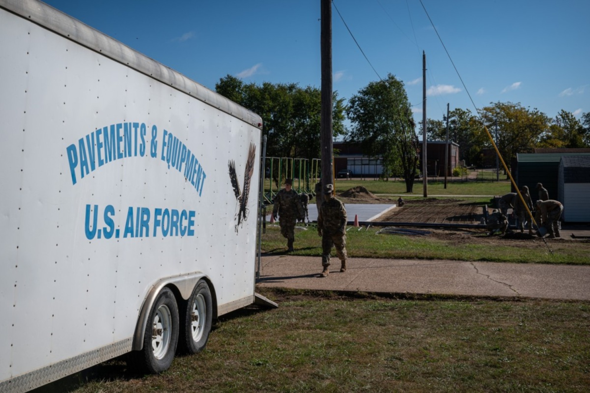 Airmen press and smooth concrete.