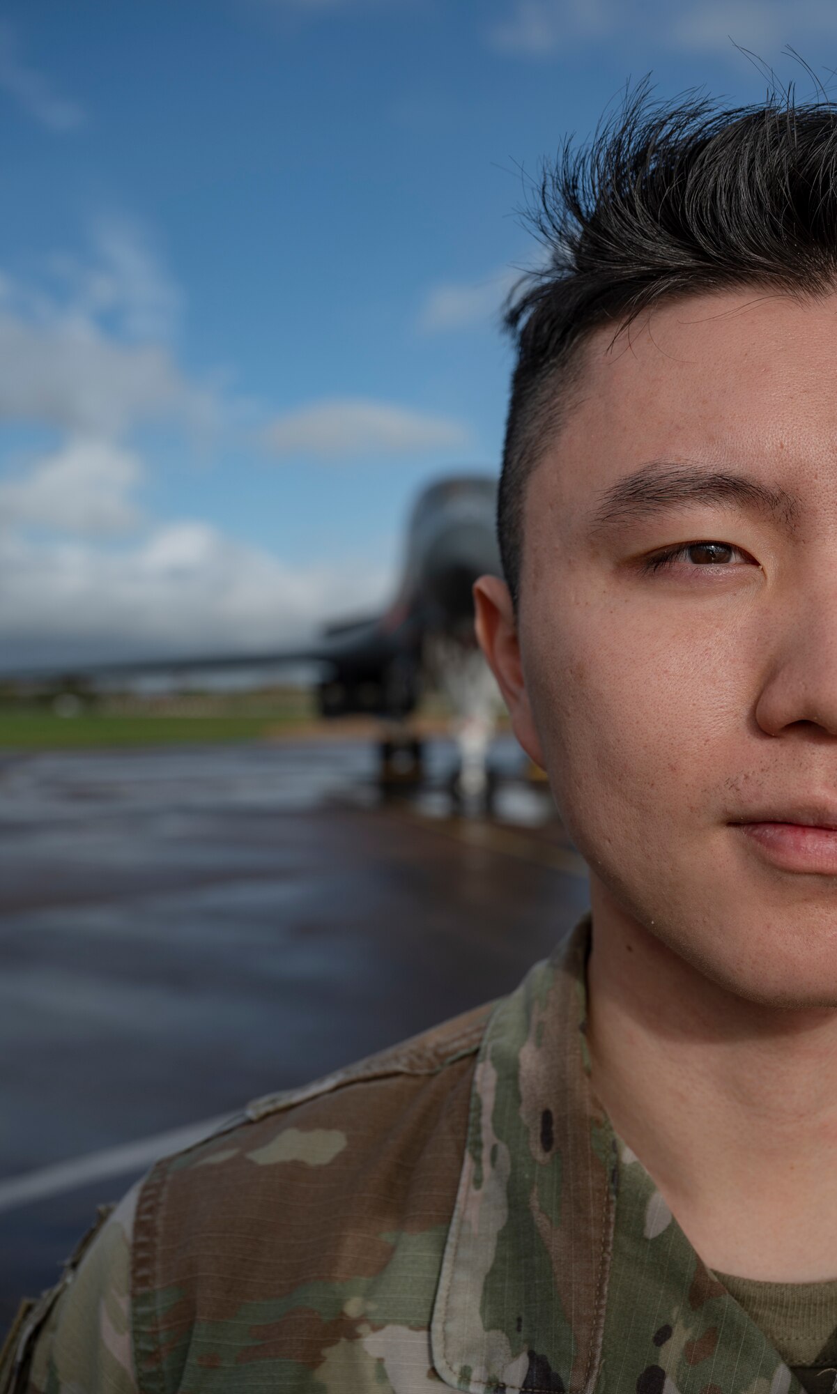 1st Lt. David Cho, 9th Expeditionary Bomb Squadron maintenance assistant officer in charge, poses for a photo at RAF Fairford, United Kingdom, Oct. 19, 2023. Cho, reminisced about his family, culture and past during his first Bomber Task Force mission. (U.S. Air Force Photo by Senior Airman Ryan Hayman)