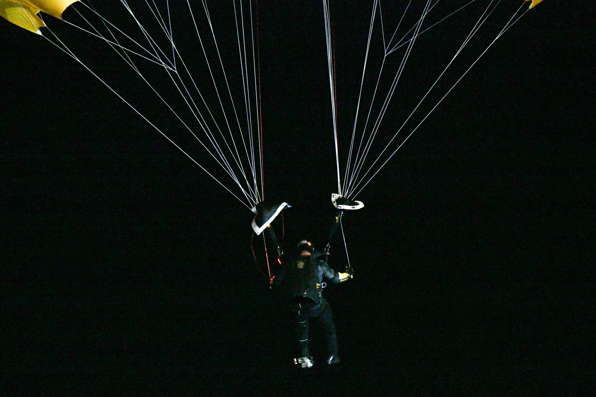Parachuter flying in the night