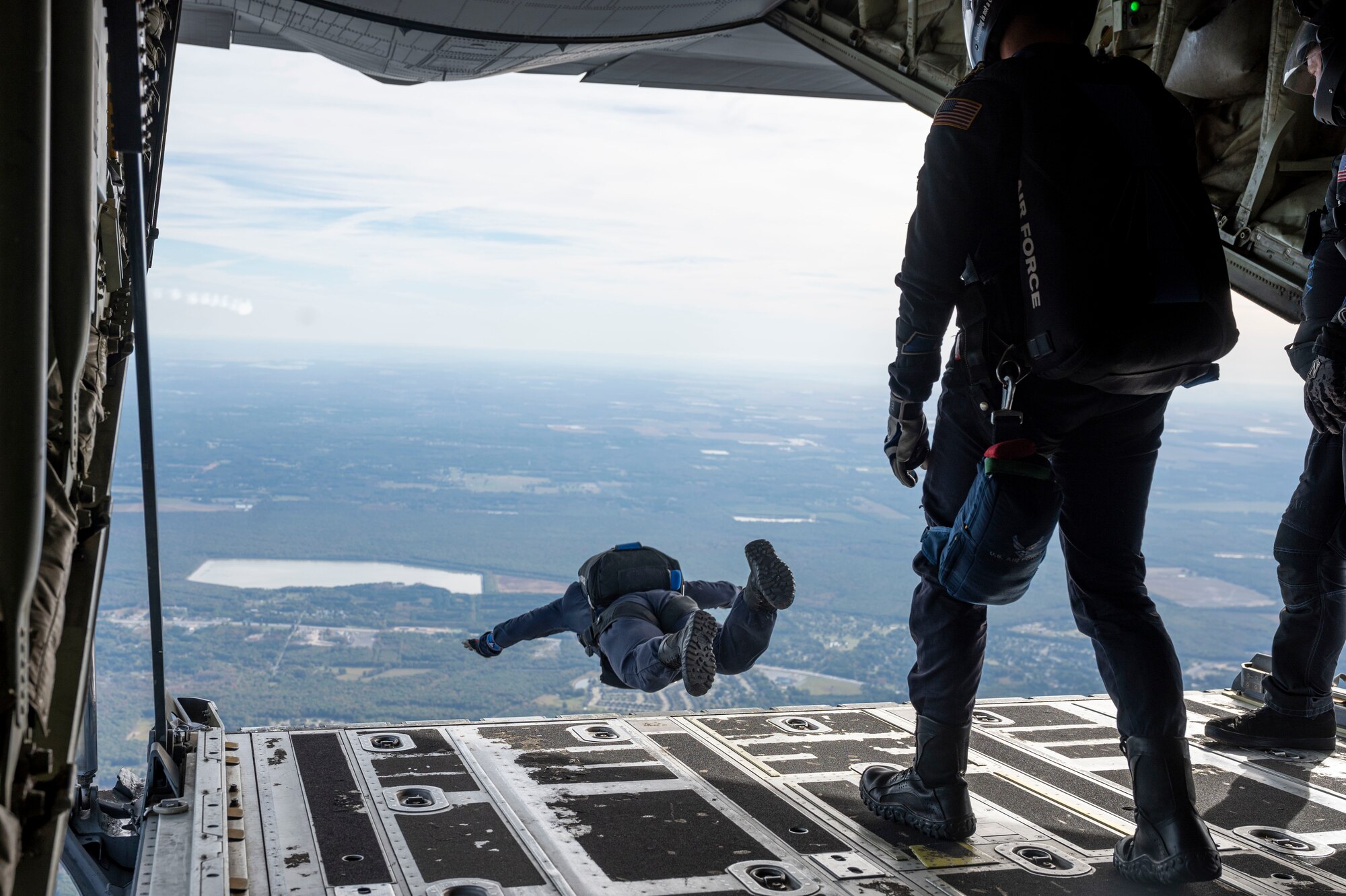 Paratrooper jumping out of plane