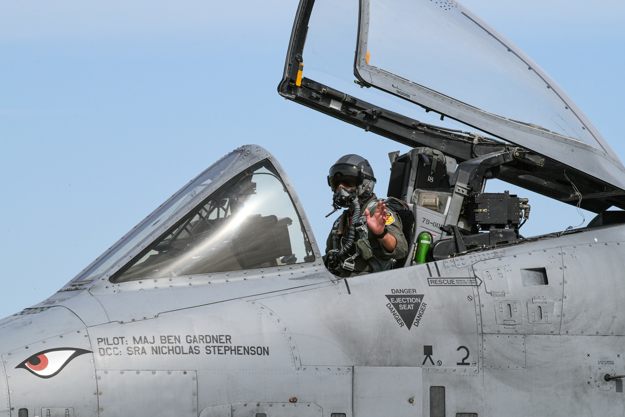 Pilot sits in A-1o Thunderbolt Airplane
