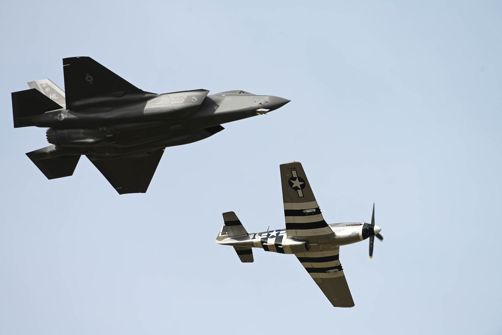 An F-35 Lightning II and a P-51 Mustang flying together