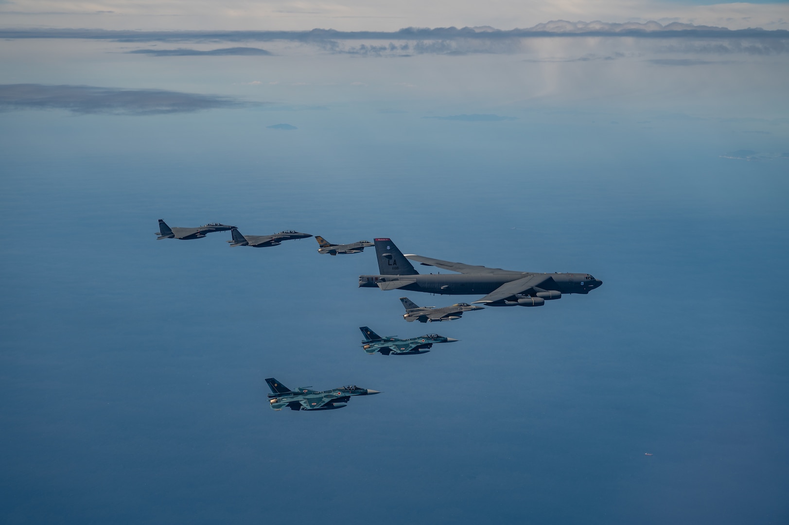 Fighter aircraft from the U.S., Japan, and the Republic of Korea conducted a trilateral escort flight of a U.S. B-52H Stratofortress Bomber operating in the Indo-Pacific, 22 Oct, 2023. U.S. F-16s from the 80th Fighter Squadron, 8th Fighter Wing flew alongside Japan Air Self-Defense Force (JASDF) F-2s from the 8th Air Wing, and Republic of Korea Air Force (ROKAF) F-15Ks from the 11th Wing. (U.S. Air Force photo by Senior Airman Karrla Parra)