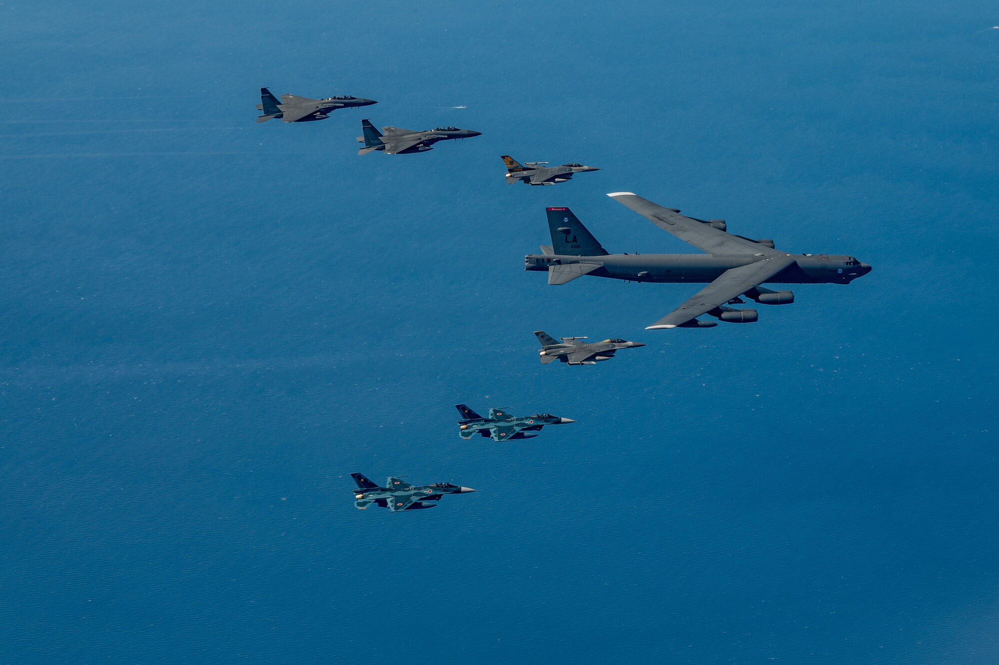 Fighter aircraft from the U.S., Japan, and the Republic of Korea conducted a trilateral escort flight of a U.S. B-52H Stratofortress Bomber operating in the Indo-Pacific, 22 Oct, 2023. U.S. F-16s from the 80th Fighter Squadron, 8th Fighter Wing flew alongside Japan Air Self-Defense Force (JASDF) F-2s from the 8th Air Wing, and Republic of Korea Air Force (ROKAF) F-15Ks from the 11th Wing. (U.S. Air Force photo by Senior Airman Karrla Parra)