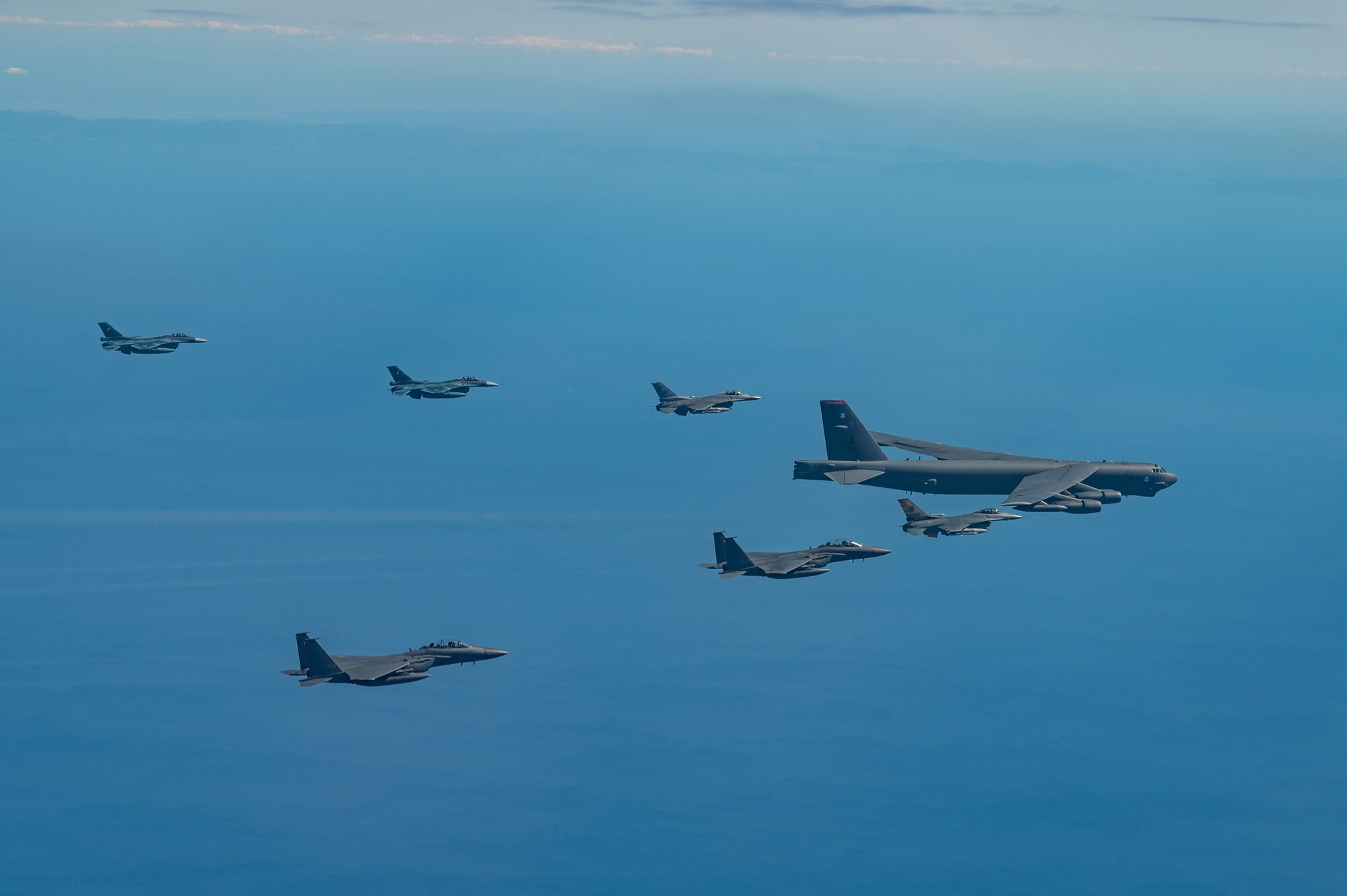 Fighter aircraft from the U.S., Japan, and the Republic of Korea conducted a trilateral escort flight of a U.S. B-52H Stratofortress Bomber operating in the Indo-Pacific, 22 Oct, 2023. U.S. F-16s from the 80th Fighter Squadron, 8th Fighter Wing flew alongside Japan Air Self-Defense Force (JASDF) F-2s from the 8th Air Wing, and Republic of Korea Air Force (ROKAF) F-15Ks from the 11th Wing. (U.S. Air Force photo by Senior Airman Karrla Parra)