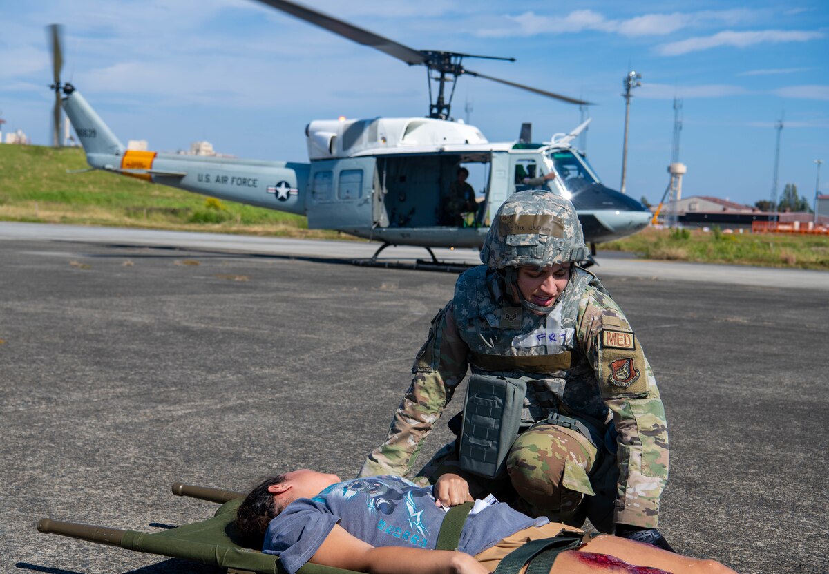 A 374th Medical Group Airman gives aid to a simulated patient