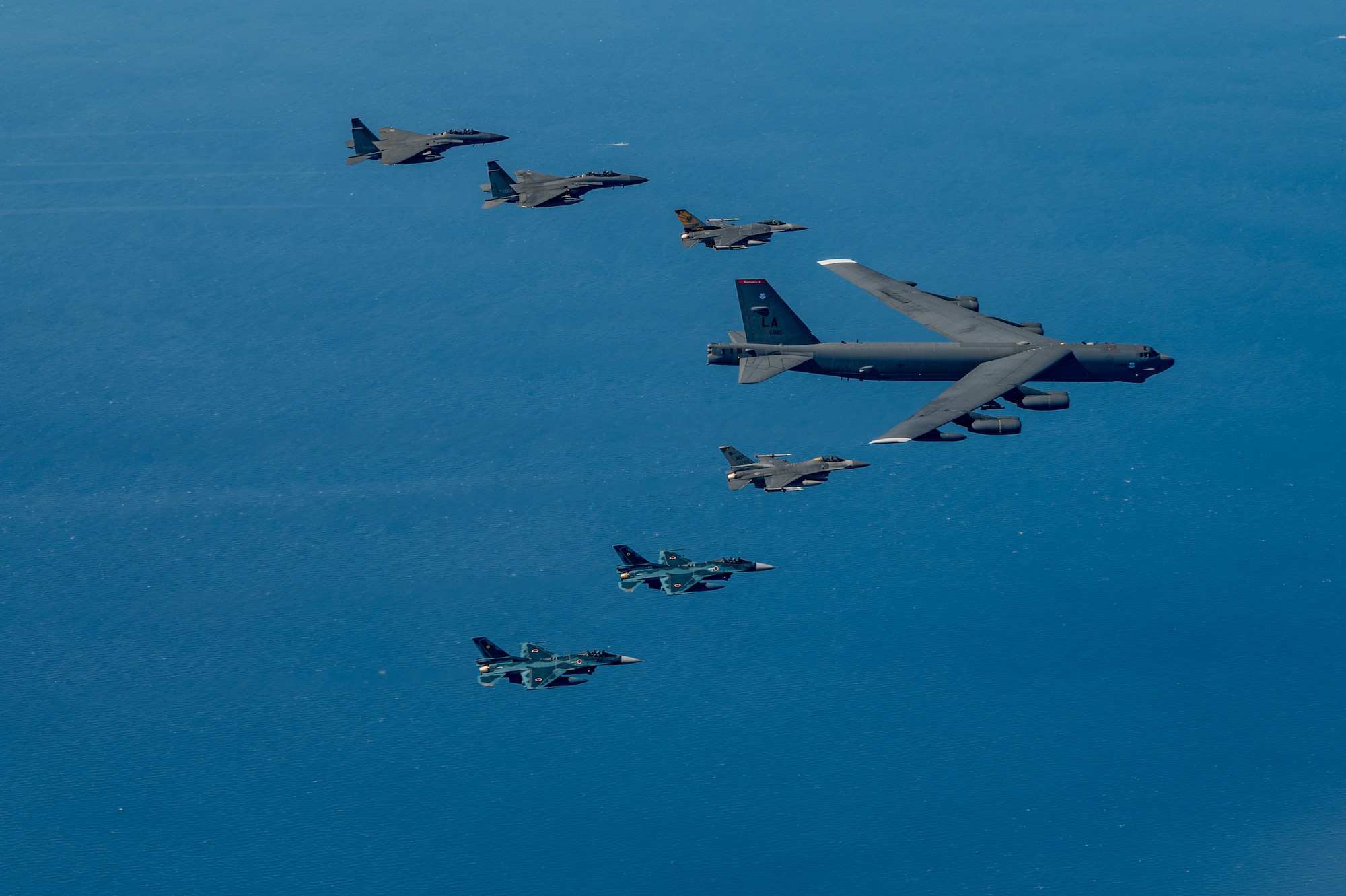 Fighter aircraft from the U.S., Japan, and the Republic of Korea conducted a trilateral escort flight of a U.S. B-52H Stratofortress Bomber operating in the Indo-Pacific, 22 Oct, 2023. U.S. F-16s from the 80th Fighter Squadron, 8th Fighter Wing flew alongside Japan Air Self-Defense Force (JASDF) F-2s from the 8th Air Wing, and Republic of Korea Air Force (ROKAF) F-15Ks from the 11th Wing. (U.S. Air Force photo by Senior Airman Karla Parra)