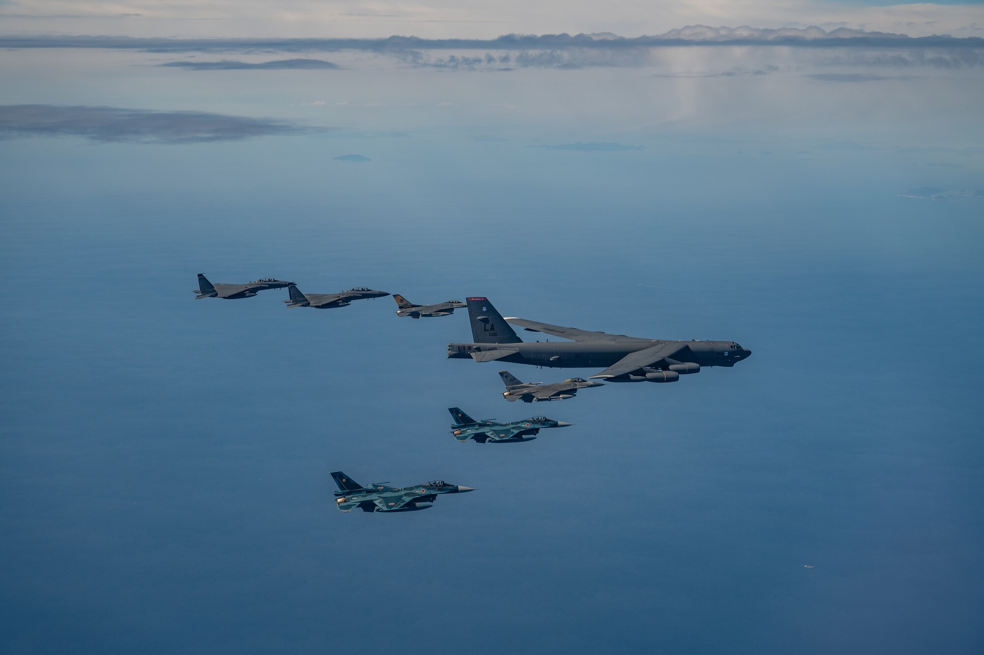 Fighter aircraft from the U.S., Japan, and the Republic of Korea conducted a trilateral escort flight of a U.S. B-52H Stratofortress Bomber operating in the Indo-Pacific, 22 Oct, 2023. U.S. F-16s from the 80th Fighter Squadron, 8th Fighter Wing flew alongside Japan Air Self-Defense Force (JASDF) F-2s from the 8th Air Wing, and Republic of Korea Air Force (ROKAF) F-15Ks from the 11th Wing. (U.S. Air Force photo by Senior Airman Karla Parra)