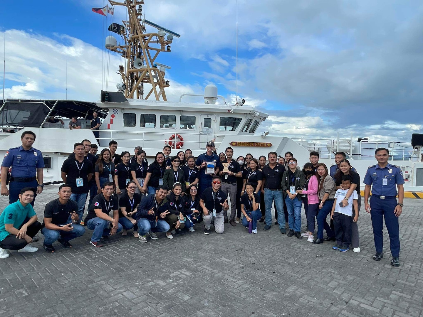 The command of USCGC Frederick Hatch (WPC 1143) stand with members of the port at the pier in Tacloban, Philippines, on Oct. 20, 2023. In a historic first, the USCGC Frederick Hatch (WPC 1143) visited Tacloban, Philippines, from Oct. 19 to 23, 2023, and the crew conducted engagements marking a significant milestone in the enduring relationship between the United States and the Philippines. (U.S. Coast Guard photo)