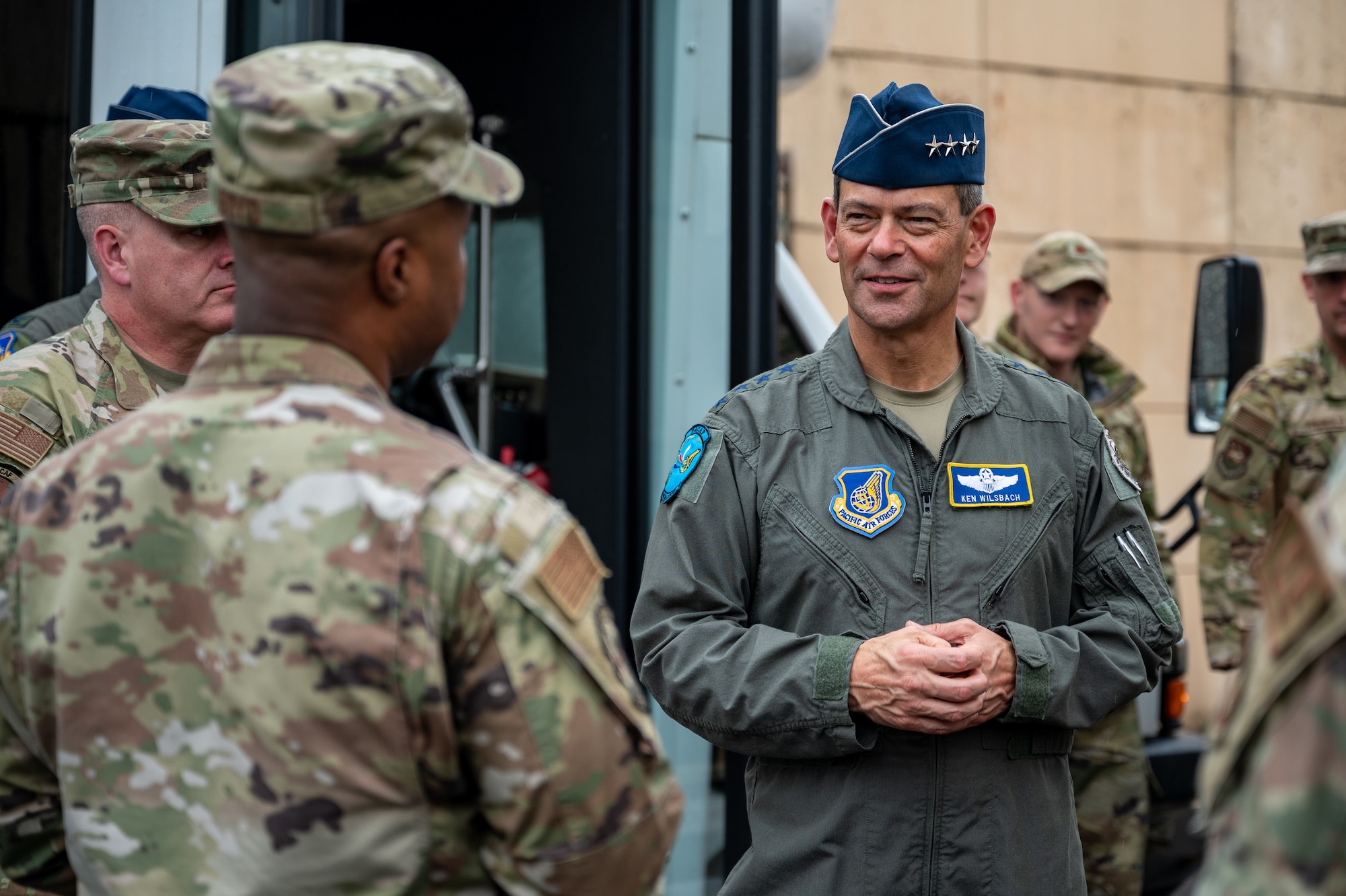 U.S. Air Force Gen. Ken Wilsbach, Pacific Air Forces commander, speaks with Senior Master Sgt. Taraus Boyd, 51st Civil Engineer Squadron operations flight superintendent, during a PACAF command team visit at Osan Air Base,
Republic of Korea, Oct. 19, 2023.