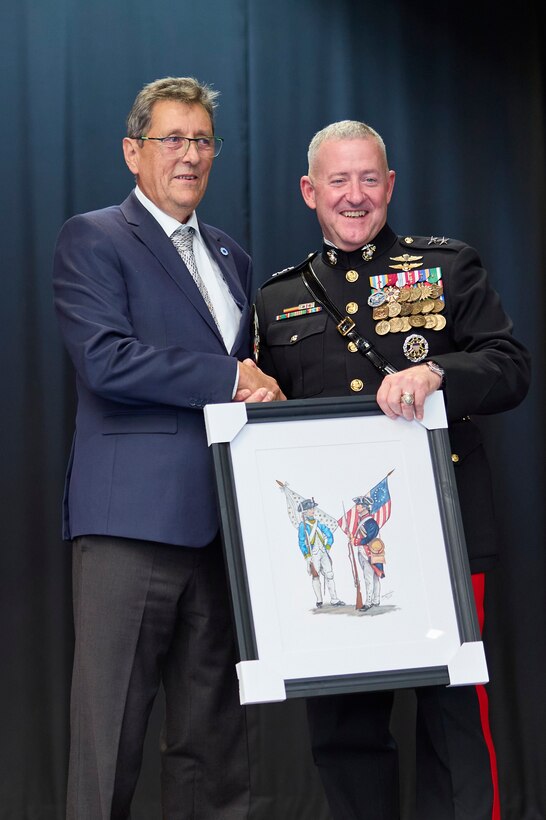 U.S. Marine Corps Maj. Gen. Robert B. Sofge Jr., commander of U.S. Marine Corps Forces Europe and Africa (MARFOREUR/AF), receives a gift from Daniel Geniteau, event organizer, during the Beirut bombing memorial in Lyon, France on Oct. 21, 2023. The Beirut bombing memorial commemorates the 40th anniversary of the attacks conducted against the French and Americans. This event occurs every five years, and notably, it’s the first time a U.S. Marine general has attended in a decade. Together, the French and U.S. Marines honor their comrades who served side by side in Lebanon in 1983, reinforcing the enduring bond between these two nations. (U.S. Marine Corps photo by Lance Cpl. Mary Linniman)