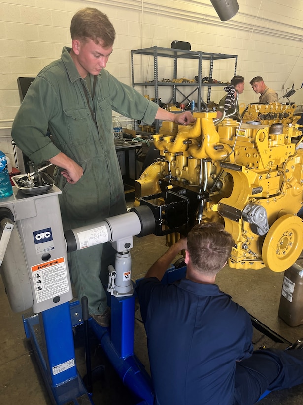 Students from NCO Mechanic Course 2-23 taking apart engines.