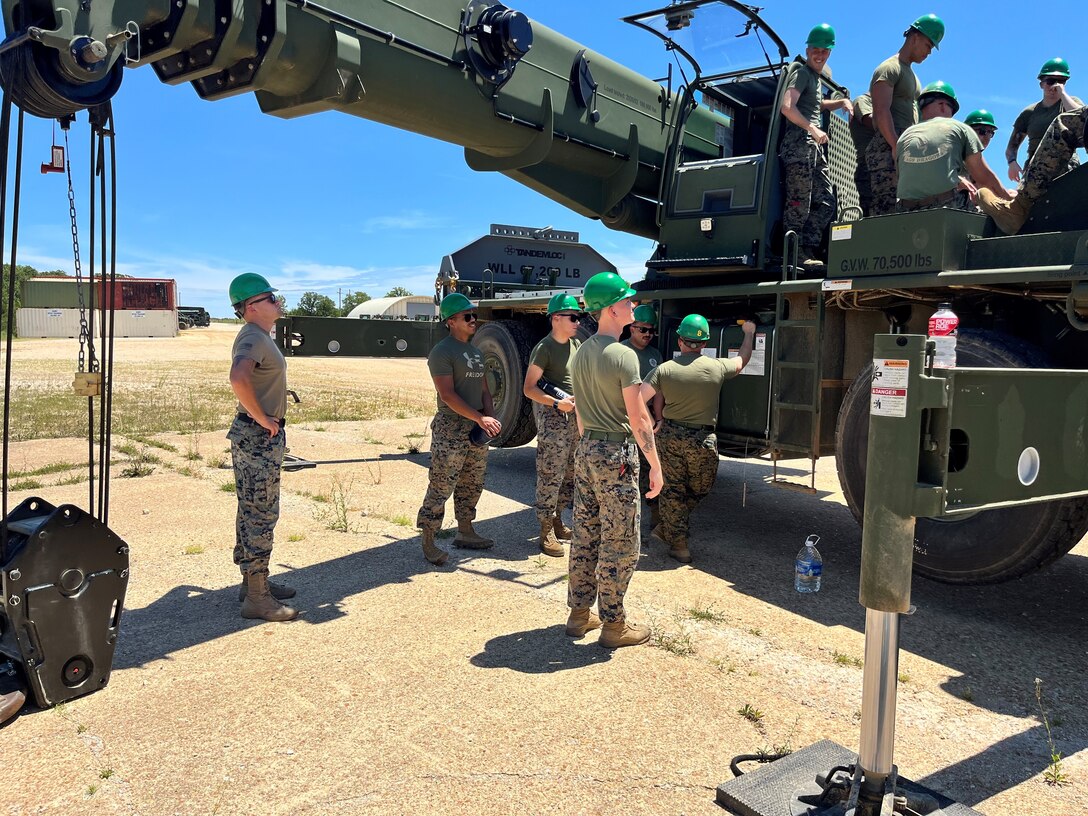 Students from NCO Mechanic Course 2-23 troubleshooting the Crane.