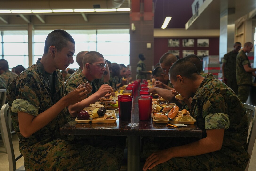 U.S. Marines with Hotel Company, 2nd Recruit Training Battalion, eat their warrior’s breakfast food after completing the crucible, at Marine Corps Base Camp Pendleton, Calif., Oct. 18, 2023. The warrior’s breakfast is a feast prepared for Marines following the completion of the 54-hour crucible course of events. (U.S. Marine Corps photo by Lance Cpl. Francisco Angel)