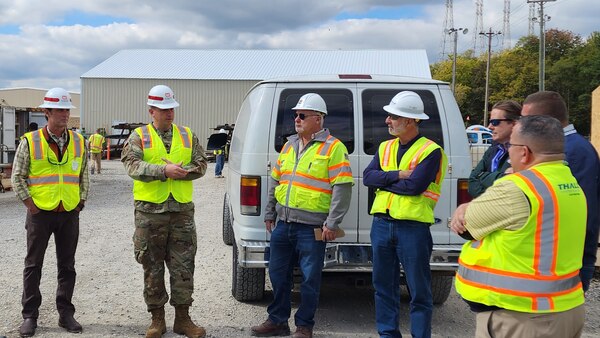 Lt. Col. Robert W. Green, U.S. Army Corps of Engineers Nashville District commander, chats with Thalle Construction Company and Tully Group officials about the safety milestone reached of 500,000 hours without a lost-time incident Oct. 17, 2023, at the Kentucky Lock Addition Project in Grand Rivers, Kentucky. (USACE Photo by Vanessa Rudd)