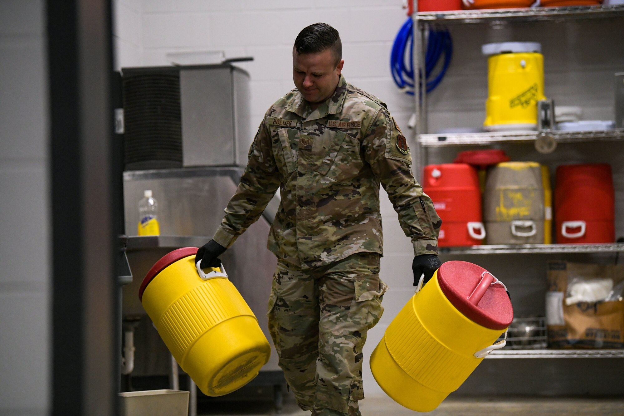 Tech. Sgt. Adam Holmes, an air transportation specialist with the 172nd Logistic Readiness Squadron, organizes his aerial port work area before inspecting equipment used to load a C-17 Globemaster III. Holmes, a volunteer firefighter known for his leadership and selfless service, recently applied his skillset and servant mentality to assist a stranded driver when no one else would. (U.S. Air National Guard photo by Staff Sgt. Jared Bounds.)

LEAVE A COMMENT
IMAGE INFO