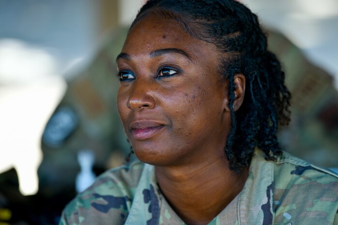 U.S. Air Force Capt. Donsha Watkins, 9th Reconnaissance Wing chaplain, sits at a table on Beale Air Force Base, California, Oct. 19, 2023.