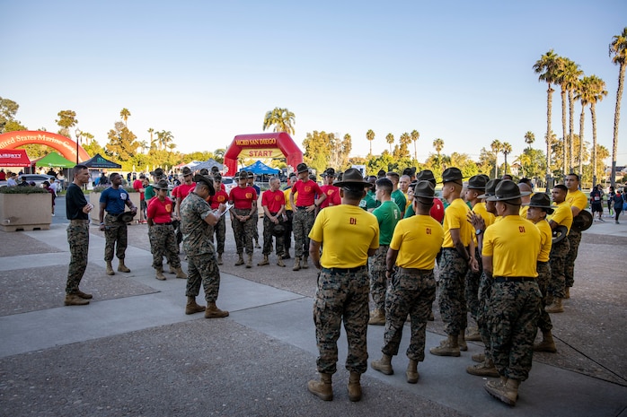 U.S. Marine Corps drill instructors with Marine Corps Recruit Depot San Diego, are briefed before participating in the Boot Camp Challenge, Oct. 21, 2023. For the past 21 years the Boot Camp Challenge has offered a unique opportunity to the public to step into the shoes of a future Marine, guided by drill instructors to conquer a three-mile obstacle race and gain experience into what recruits go through during boot camp. (U.S. Marine Corps photo by Sgt. Yvonna Guyette)