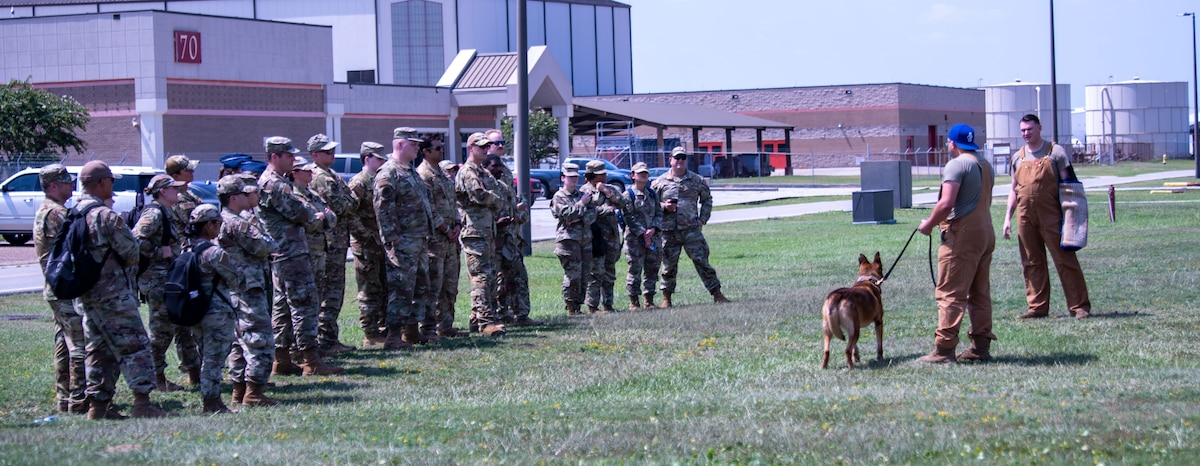 Airmen from the 183rd Aeromedical Evacuation Squadron, Jackson, Mississippi, and the 189th Medical Group, Arkansas Air National Guard, participate in canine familiarization training during annual training in Gulfport, Mississippi on July 20, 2023. The 183rd Aeromedical Evacuation Squadron annual training this year also included tactical combat casualty care and simulated search and rescue missions with the 189th Medical Group, Arkansas ANG, U.S. Coast Guard Station New Orleans and U.S. Coast Guard Station Gulfport. (U.S. Air National Guard photo by Airman 1st Class Shardae McAfee)