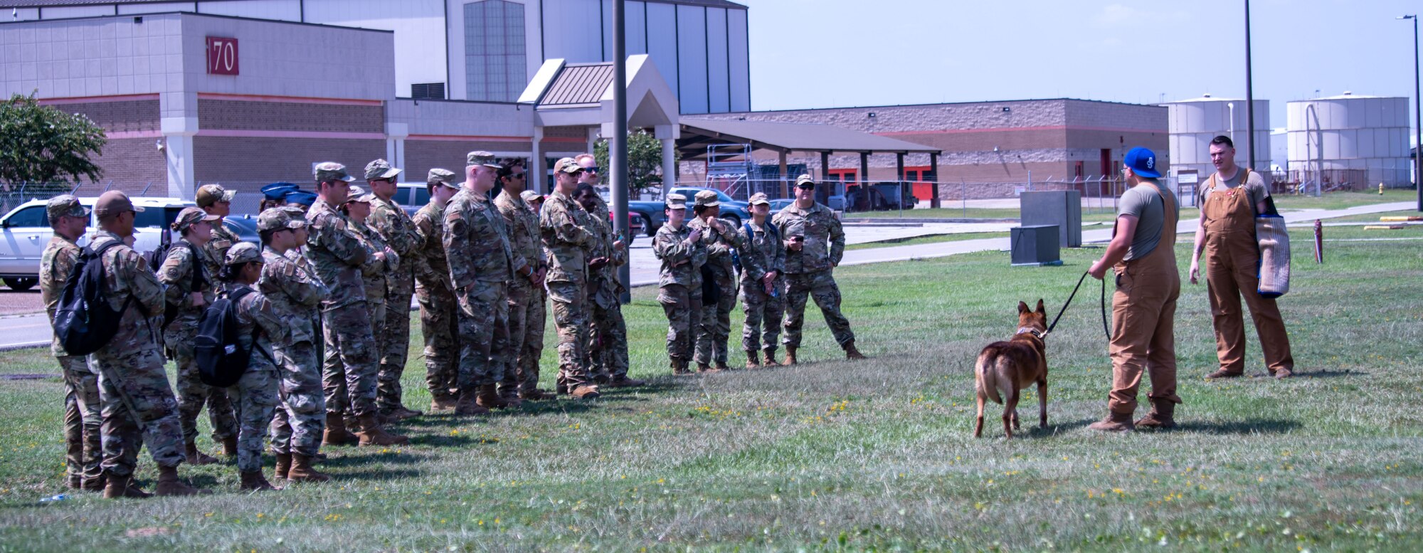 Airmen from the 183rd Aeromedical Evacuation Squadron, Jackson, Mississippi, and the 189th Medical Group, Arkansas Air National Guard, participate in canine familiarization training during annual training in Gulfport, Mississippi on July 20, 2023. The 183rd Aeromedical Evacuation Squadron annual training this year also included tactical combat casualty care and simulated search and rescue missions with the 189th Medical Group, Arkansas ANG, U.S. Coast Guard Station New Orleans and U.S. Coast Guard Station Gulfport. (U.S. Air National Guard photo by Airman 1st Class Shardae McAfee)