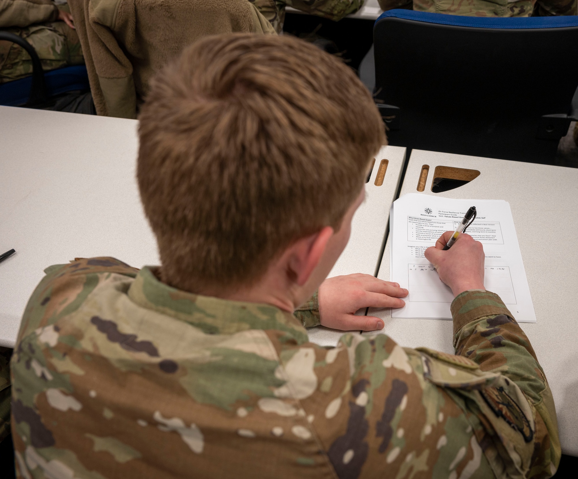 A 4th Fighter Wing Airman fills out his goals and strengthens during a resilience course at Seymour Johnson Air Force Base, North Carolina, Dec. 14, 2022. To become a certified Master Resilience Trainer, one first must become a Resilient Trainer Assistant, which takes about three days, then attend a week-long MRT course. Williams started his career as a Resilience Trainer Assistant in 2019. (U.S. Air Force photo by Senior Airman Sabrina Fuller)
