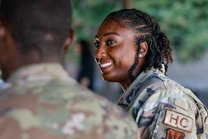 U.S. Air Force Capt. Donsha Watkins, 9th Reconnaissance Wing chaplain, interacts with another Airman on Beale Air Force Base, California, Oct. 19, 2023.