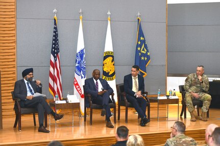 Gurpreet Bhatia, left, the Defense Department's principal director for cybersecurity, illustrates a point as other panelists listen during a townhall discussion on cybersecurity Oct. 19, 2023, at the Herbert R. Temple Jr. Army National Guard Readiness Center, Arlington Hall Station, Virginia. The other panelists included, left to right, Kenneth McNeill, the chief information officer with the National Guard Bureau’s communications and computers directorate; Leonel Garciga, chief information officer for the Army, and Air Force Col. Jack Johnson, director of intelligence and cyber effects for the Air National Guard’s intelligence and computers directorate.