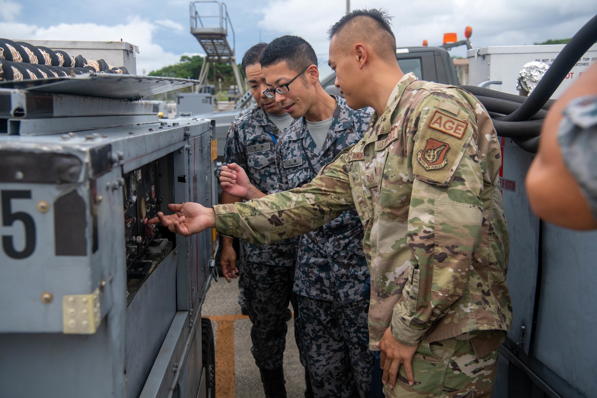 18th Wing EMS members discus the difference in equipment with JASDF members