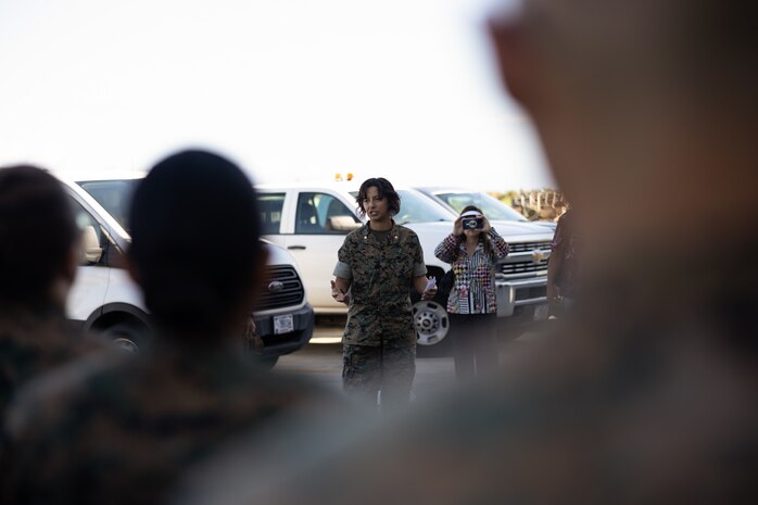 U.S. Marine Corps Maj. Jocelyn Mills, communications relations officer for Marine Corps Base Hawaii, briefs Army and Air Force Junior ROTC cadets from Kailua and Farrington High Schools during a visit to MCBH, Oct. 3, 2023. The visit provided cadets the opportunity to experience and gain an understanding of the various military career fields across and supporting the installation. (U.S. Marine Corps photo by Lance Cpl. Samuel Estridge)