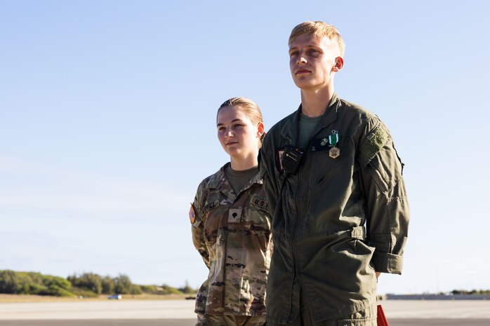 U.S. Marine Corps Cpl. Ethan Merrill, right, crash fire rescue firefighter, Aircraft Rescue and Firefighting, Marine Corps Air Station (MCAS) Kaneohe Bay, and Army Spc. Haley Merrill, fire support specialist, 2nd Battalion, 11th Field Artillery Regiment, 25th Infantry Division, are recognized by MCAS Kaneohe Bay leadership during an awards ceremony, Marine Corps Base Hawaii, Oct. 5, 2023. Merrill took life-saving action on June 12, 2023, when a fellow service member was involved in a motorcycle accident.  (U.S. Marine Corps photo by Sgt. Brandon Aultman)