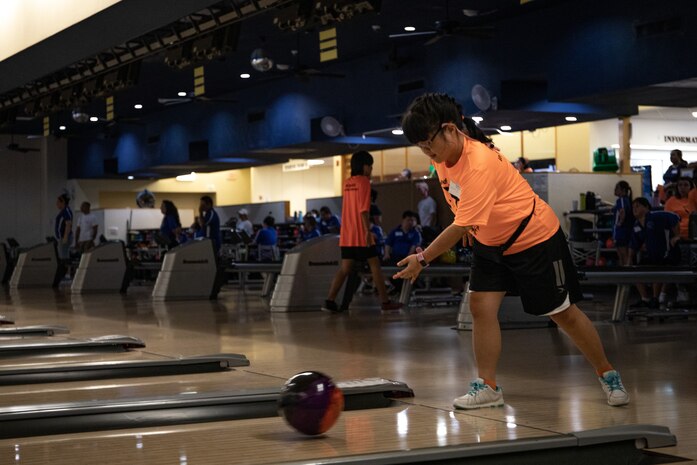 A Special Olympics athlete, with the Windward Warriors Team, competes in the bowling division of the 2023 Special Olympics Holiday Classic State Games Qualifier on Marine Corps Base Hawaii, Oct. 8, 2023. MCBH and Joint Base Pearl Harbor-Hickam will host athletes from all over the Hawaiian Islands to compete in bocce, bowling, and basketball during the Holiday Classic State Games. Special Olympics Hawaii provides year-round sports training and competition for children and adults with intellectual disabilities. (U.S. Marine Corps photo by Lance Cpl. Hunter Jones)