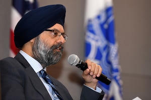 Gurpreet Bhatia, the Defense Department's principal director for cybersecurity, illustrates a point during a townhall discussion on cybersecurity Oct. 19, 2023 at the Herbert R. Temple Jr. Army National Guard Readiness Center, Arlington Hall Station, Virginia. The event was part of a government-wide recognition of Cybersecurity Awareness Month.