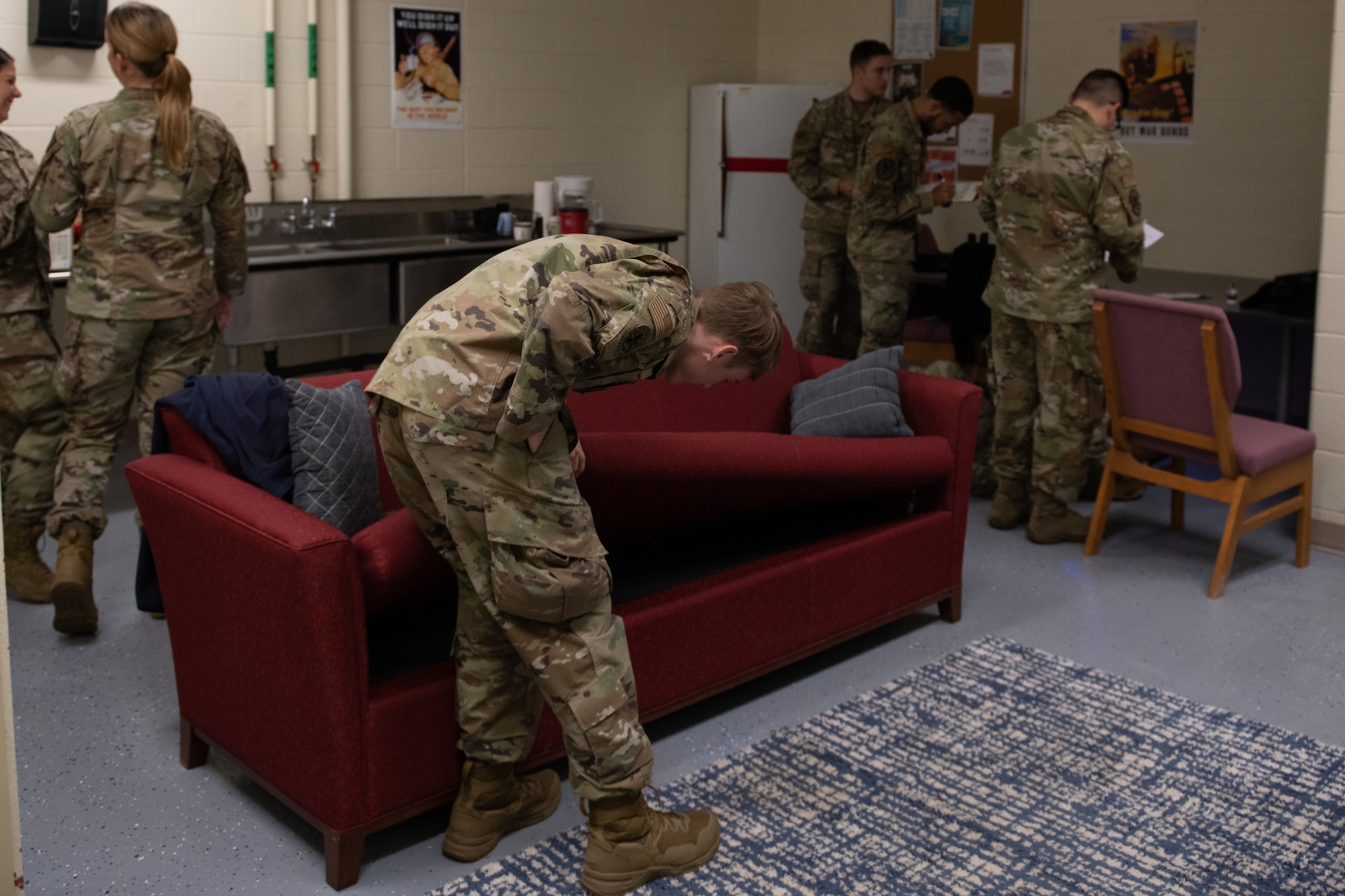 Airmen uncover clues in a discovery room exercise.