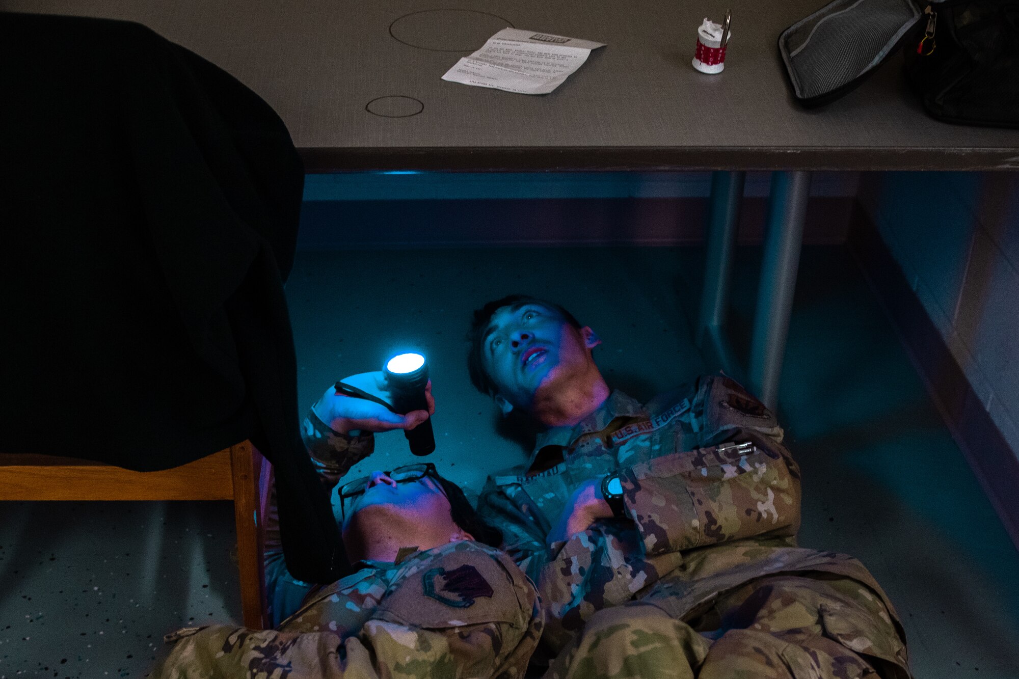Airmen uncover clues in a discovery room exercise.