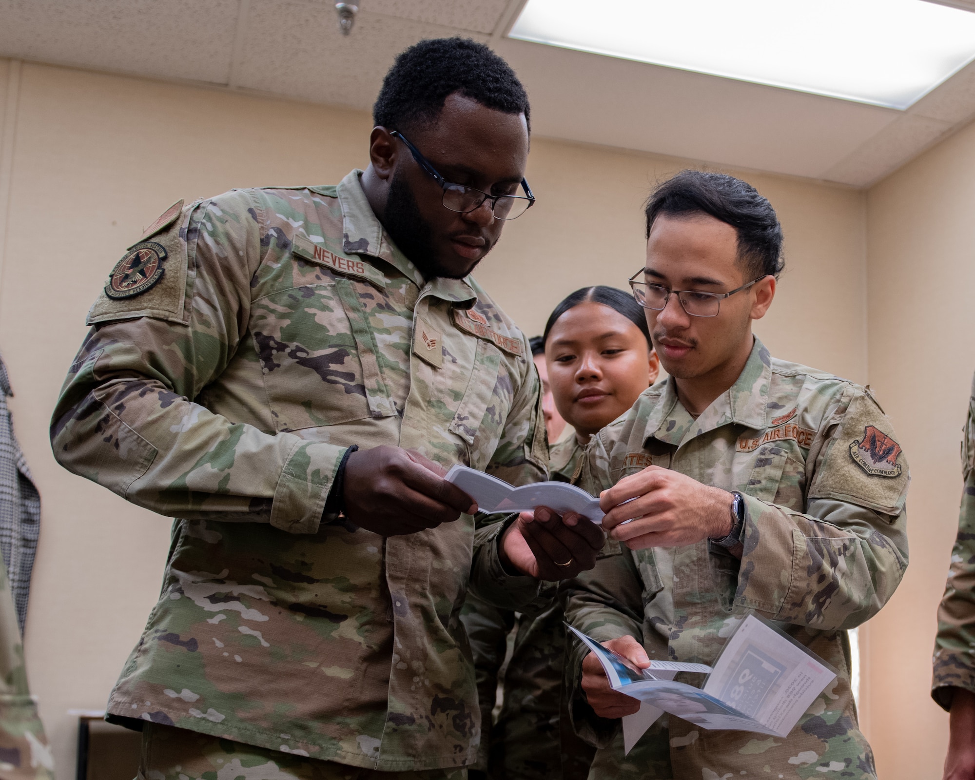 Airmen uncover clues in a discovery room exercise.