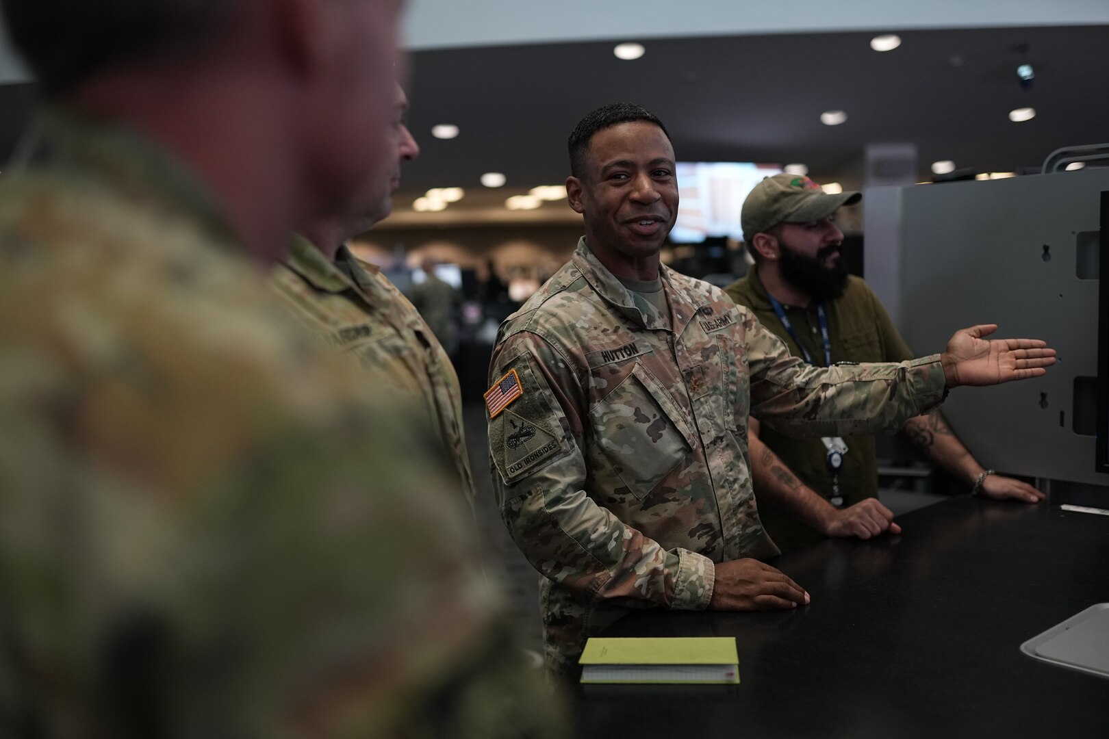 Joint Operation Center watch floor personnel at U.S. Cyber Command recap daily defensive cyber actions supporting an International Coordinated Cyber Security Activity.