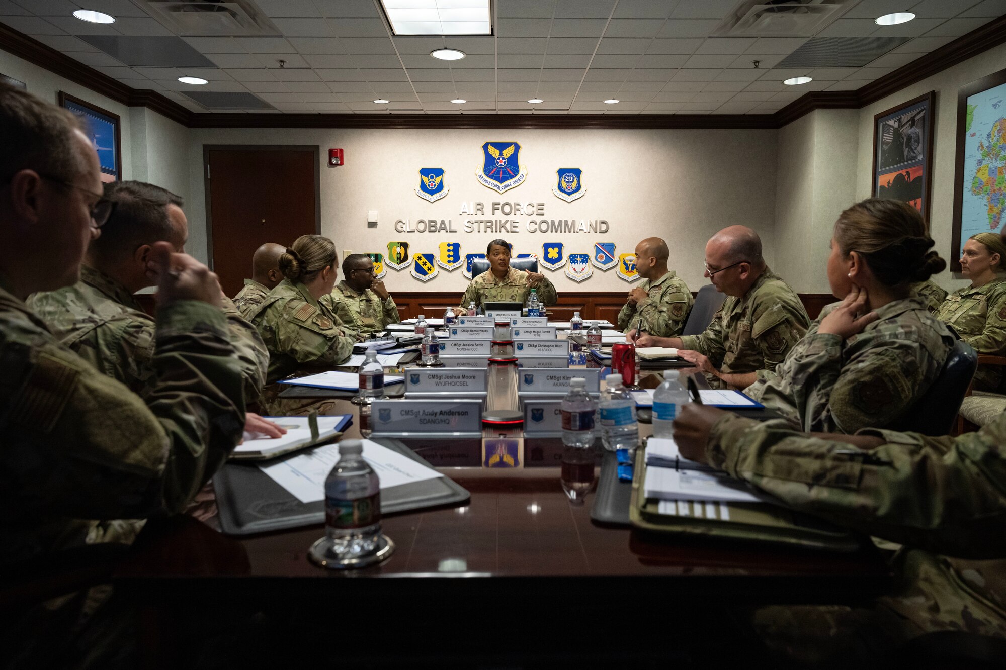 People speak at a conference table