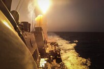 USS Carney (DDG 64) fires a Standard Missile (SM) 2 to defeat a combination of Houthi missiles and unmanned aerial vehicles in the Red Sea.