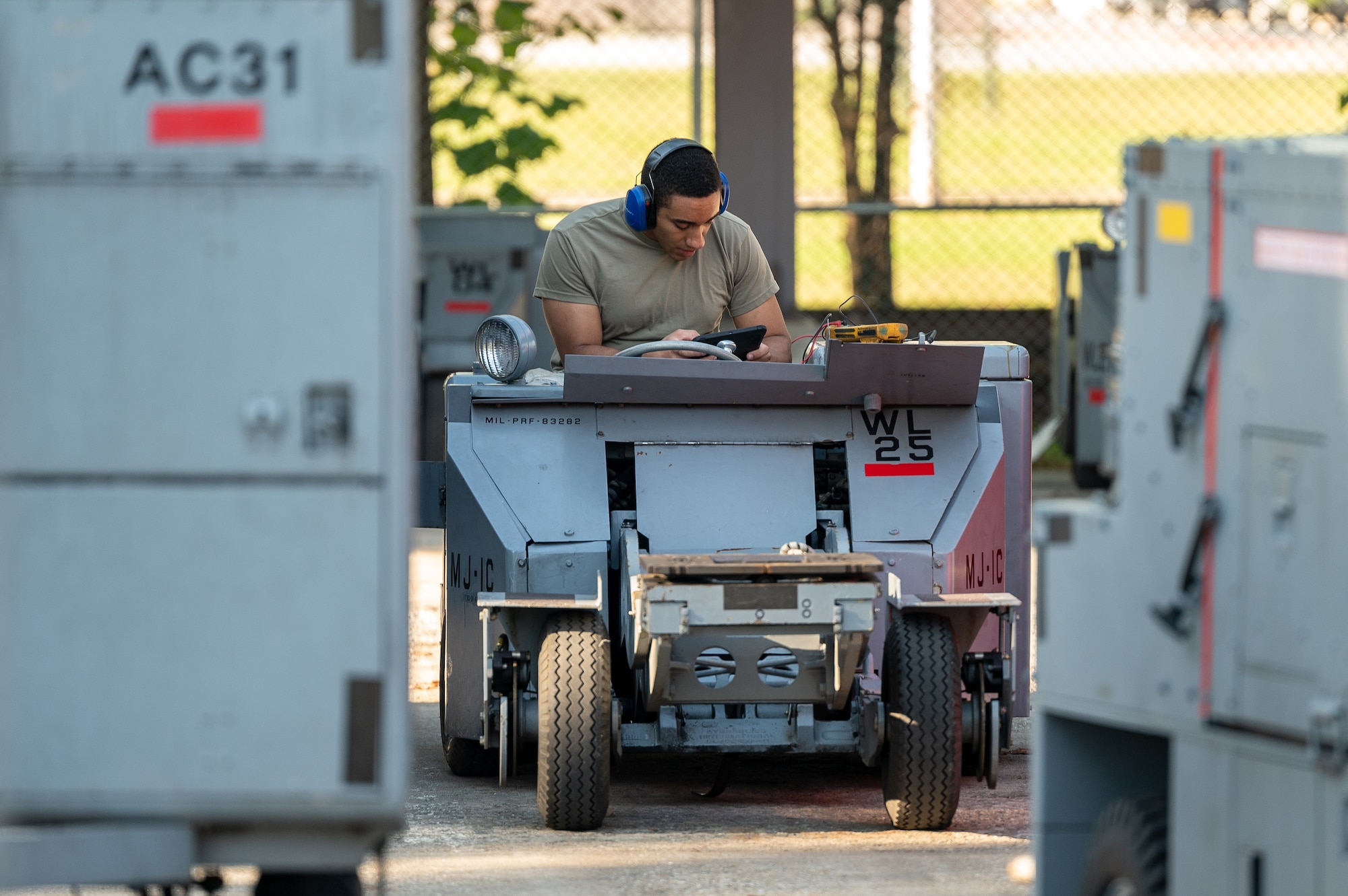 U.S. Air Force Tech. Sgt. Davood Amini, 51st Maintenance Squadron aerospace ground equipment craftsman, conducts routine maintenance on a bomb lift at Osan Air Base, Republic of Korea, Oct. 2, 2023. AGE technicians manage the inspection and maintenance of ground equipment, a critical aspect of ensuring pilots of the 25th and 36th Fighter Squadrons are prepared to fly, fight and win at any time. The bomb lifts maintained by AGE technicians are crucial to arming the A-10C Thunderbolt IIs and F-16 Fighting Falcons assigned to the 51st Fighter Wing, ensuring the ROK remains safe and combat-ready. (U.S. Air Force photo by Staff Sgt. Thomas Sjoberg)
