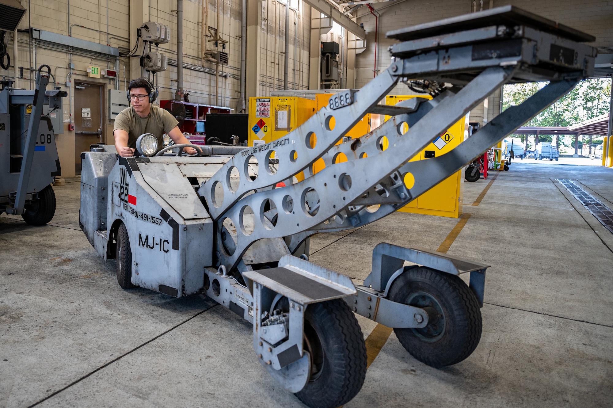 U.S. Air Force Senior Airman Jimi Hernandez, 51st Maintenance Squadron aerospace ground equipment journeyman, conducts a routine inspection on a bomb lift at Osan Air Base, Republic of Korea, Oct. 2, 2023. By inspecting and maintaining equipment, AGE technicians reduce aircraft downtime, ensuring readiness for rapid aircraft deployment. The bomb lifts maintained by AGE technicians are crucial to arming the A-10C Thunderbolt IIs and F-16 Fighting Falcons assigned to the 51st Fighter Wing, ensuring the ROK remains safe and combat-ready. (U.S. Air Force photo by Staff Sgt. Thomas Sjoberg)
