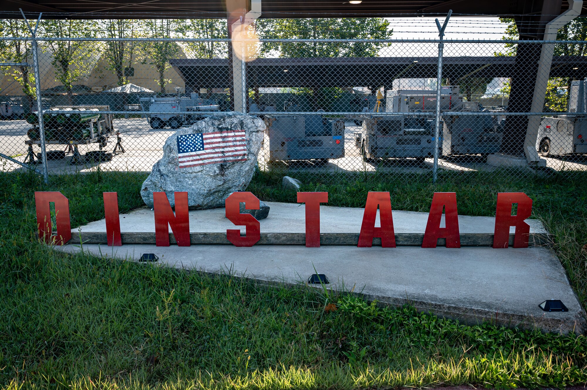 The 51st Maintenance Squadron's new aerospace ground equipment shop sign reads “DINSTAAR” as of Osan Air Base, Republic of Korea, Oct. 2, 2023. "DINSTAAR", an acronym for "Danger Is No Stranger to an AGE Ranger", honors the AGE personnel/rangers who persisted in performing their duties valiantly during wartime incidents. (U.S. Air Force photo by Staff Sgt. Thomas Sjoberg)