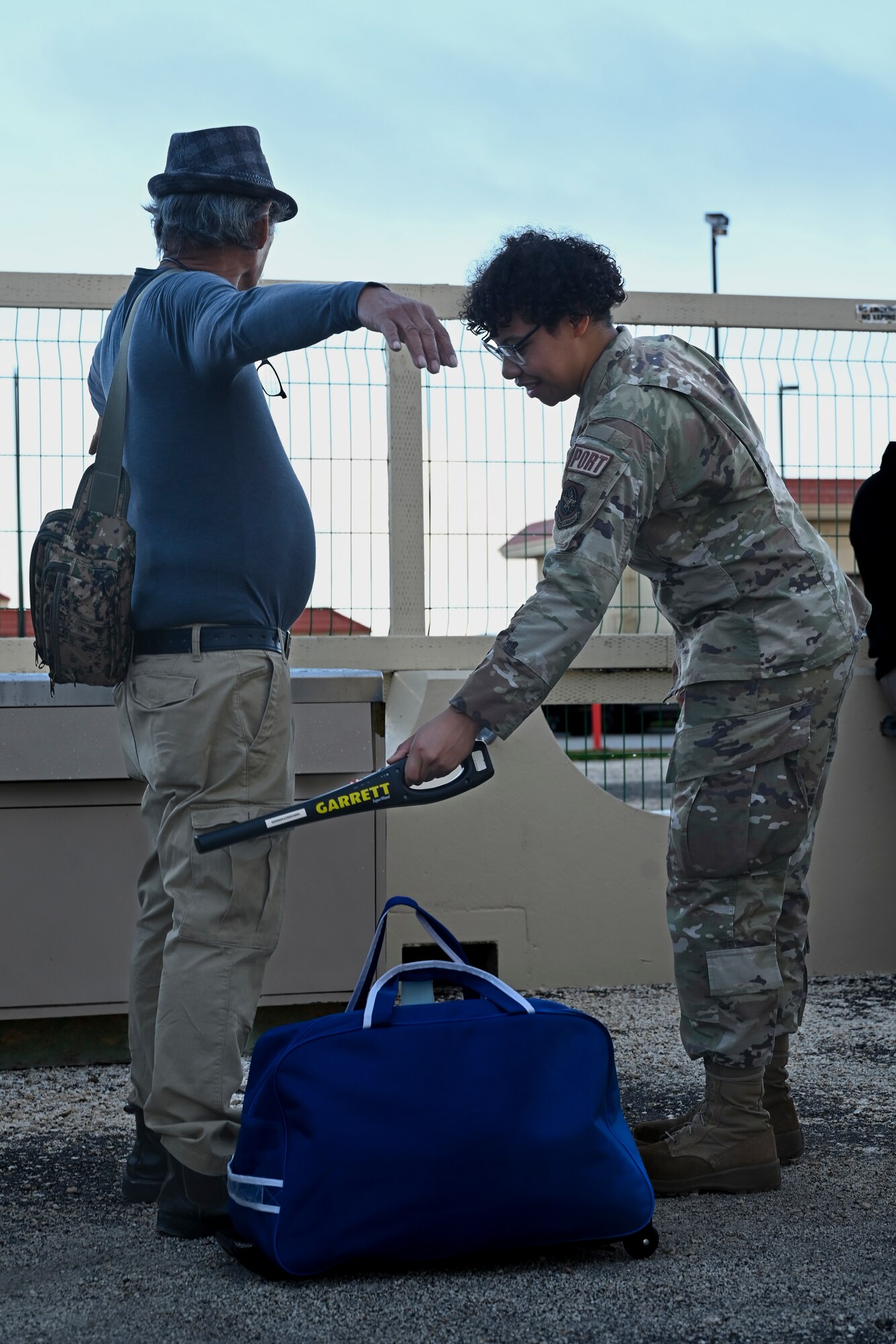 U.S. Air Force Airman 1st Class Aminta Brown, 734th Air Mobility Squadron passenger service agent, conducts safety protocol prior to their flight at Andersen Air Force Base, Guam, Oct. 19, 2023.