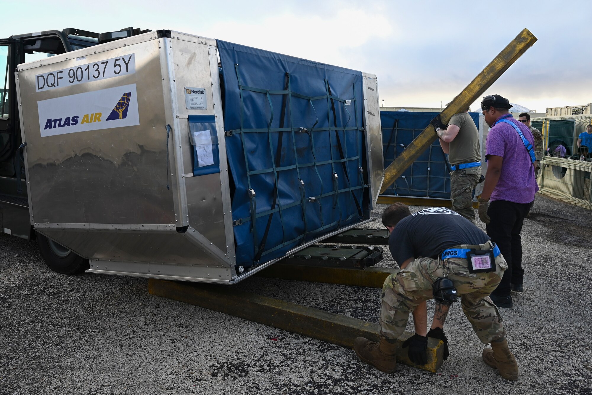 Members assigned to the 734th Air Mobility Squadron move supports to assist a forklift picking up baggage at Andersen Air Force Base, Guam, Oct. 19, 2023.
