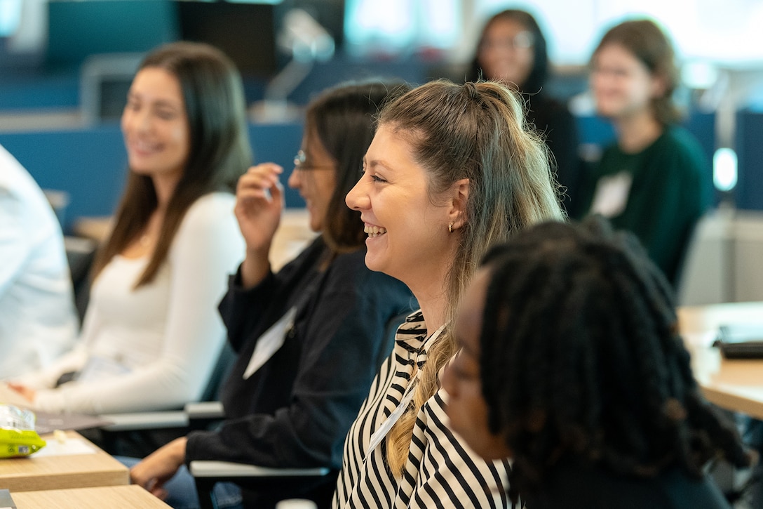 Women in a classroom laughing