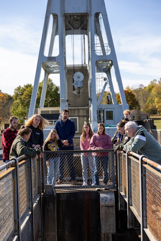 In a convergence of academia and real-world engineering, a group of students from the University of Pittsburgh’s Hydrologic Analysis and Design course explored the Conemaugh River Dam to expand their engineer learning beyond conventional classroom boundaries. University of Pittsburgh students view the Conemaugh River Dam from the top looking down as April Richards, a park ranger with the U.S. Army Corps of Engineers Pittsburgh District, explains the dam’s construction in Saltsburg, Pennsylvania, Oct. 13, 2023.