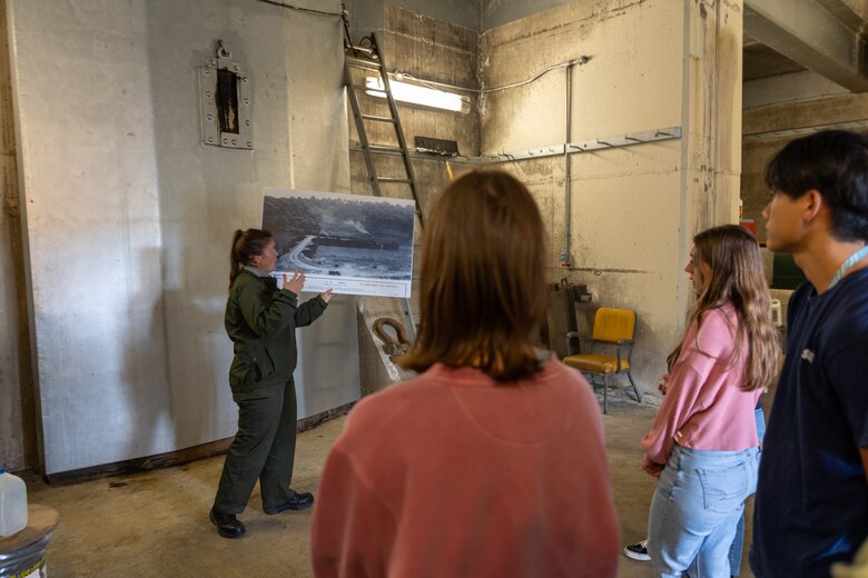 In a convergence of academia and real-world engineering, a group of students from the University of Pittsburgh’s Hydrologic Analysis and Design course explored the Conemaugh River Dam to expand their engineer learning beyond conventional classroom boundaries. April Richards, a park ranger with the U.S. Army Corps of Engineers Pittsburgh District, shows University of Pittsburgh students historical construction photos of the Conemaugh River Dam in Saltsburg, Pennsylvania, Oct. 13, 2023.