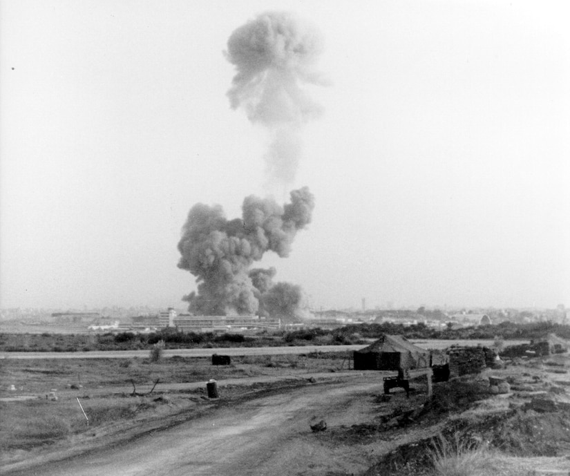 Smoke billows from a building.