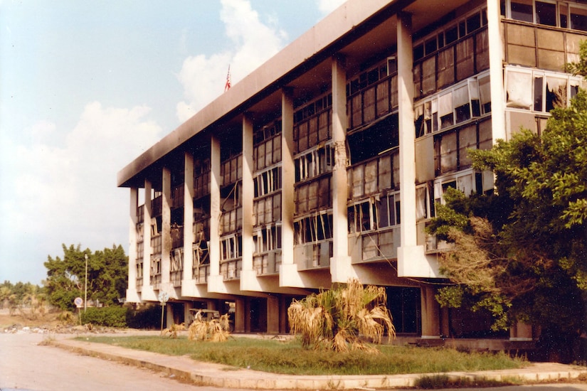 A photo shows a midrise building.