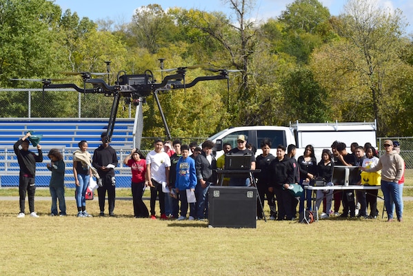 Nate Brock, UAS pilot in the Survey Mapping Section, flies a LIDAR drone above Antioch Middle School’s football field as students watch and ask questions during a Tennessee STEAM Festival event Oct. 17, 2023, in Antioch, Tennessee. The U.S. Army Corps of Engineers Nashville District partnered with the school to “show and tell” about the careers related to science, technology, engineering, arts, and mathematics. (USACE Photo by Lee Roberts)