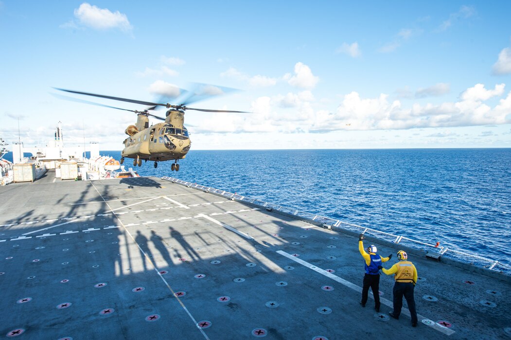 A U.S. Army CH-47 Chinook helicopter takes off from USNS Mercy (T-AH 19) in the Pacific Ocean.